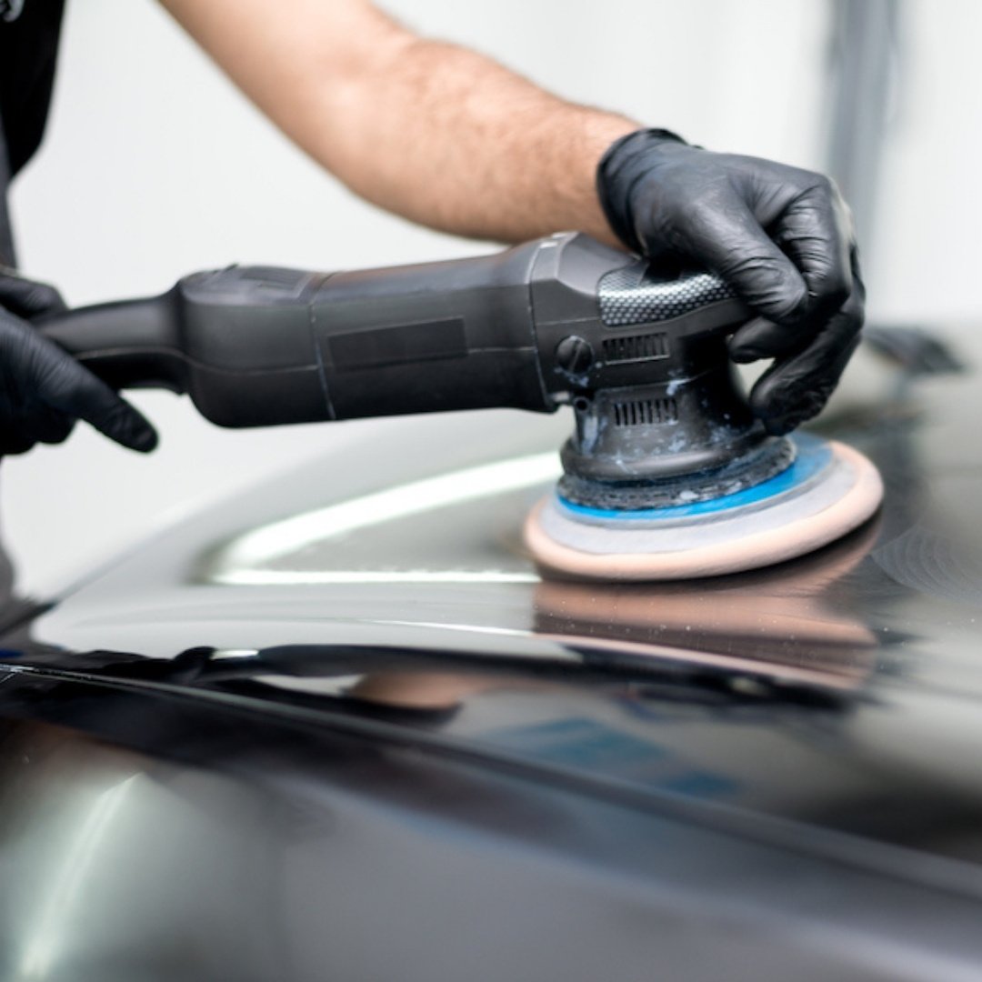 Dual-action polisher removing swirl marks during paint correction in Oakland, CA